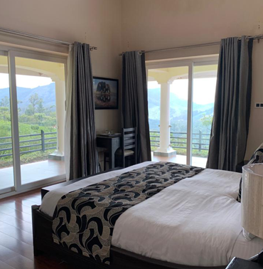 Tranquil Retreat: Bedroom in the Presidential Suite at Farview Mountain Resort Villas